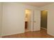 Bright bedroom featuring laminated wood floors, light walls, and access to bathroom at 16 Water Trak, Ocala, FL 34472
