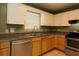 Kitchen featuring stainless steel appliances, a double sink, and tile flooring at 16 Water Trak, Ocala, FL 34472