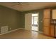 Open kitchen with tile floor and sliding door to screened porch at 16 Water Trak, Ocala, FL 34472