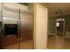 Stainless steel refrigerator with water dispenser, white door, and tile flooring in kitchen area at 16 Water Trak, Ocala, FL 34472