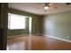 Bright, empty living room featuring hardwood floors and a ceiling fan at 16 Water Trak, Ocala, FL 34472