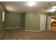 A spacious living room with carpet and an opening to the kitchen at 16 Water Trak, Ocala, FL 34472