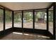 Screened-in patio overlooking the backyard and a storage shed at 16 Water Trak, Ocala, FL 34472