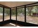 Screened-in patio overlooking the backyard and a storage shed at 16 Water Trak, Ocala, FL 34472