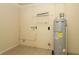 Utility room with water heater, plumbing fixtures, and tiled floor at 16 Water Trak, Ocala, FL 34472