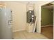 Utility room with hot water tank, HVAC system, and tiled floor at 16 Water Trak, Ocala, FL 34472