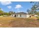 View of home and spacious backyard featuring natural landscape and outdoor seating at 16848 Sw 41St Avenue Rd, Ocala, FL 34473