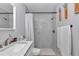 Bathroom features a single vanity, and a walk-in shower with white marble tile at 16848 Sw 41St Avenue Rd, Ocala, FL 34473