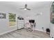 Office/bedroom features a work desk, and large window with a view to the backyard at 16848 Sw 41St Avenue Rd, Ocala, FL 34473