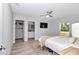 Bright bedroom features ceiling fan, ensuite access, closet, and a view to the backyard at 16848 Sw 41St Avenue Rd, Ocala, FL 34473