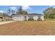 Attractive one-story home with a two-car garage, well-kept landscaping, and a sealed driveway at 16848 Sw 41St Avenue Rd, Ocala, FL 34473