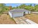 Well-maintained single-Gathering home featuring a spacious driveway and attached two-car garage at 16848 Sw 41St Avenue Rd, Ocala, FL 34473