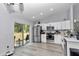 Bright kitchen with backyard view, quartz countertops, stainless steel appliances, and white cabinets at 16848 Sw 41St Avenue Rd, Ocala, FL 34473