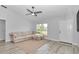 Neutral living room boasts a comfortable sectional sofa, natural light and plank floors at 16848 Sw 41St Avenue Rd, Ocala, FL 34473