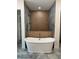 Luxurious bathroom featuring a sleek soaking tub, wood accents, and modern fixtures at 18890 Sw 60Th St, Dunnellon, FL 34432
