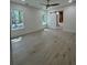 Spacious bedroom with views of the trees and a sliding barn door that leads to the bathroom at 18890 Sw 60Th St, Dunnellon, FL 34432