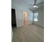 This bedroom features wood floors and a view into the bathroom at 18890 Sw 60Th St, Dunnellon, FL 34432