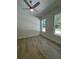 A bright and airy bedroom featuring wood floors, neutral walls and large windows at 18890 Sw 60Th St, Dunnellon, FL 34432