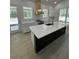 Kitchen boasts a large island, countertops, and stainless steel appliances at 18890 Sw 60Th St, Dunnellon, FL 34432
