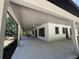 Spacious outdoor patio with ceiling fans offers ample room for entertaining and relaxation at 18890 Sw 60Th St, Dunnellon, FL 34432