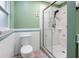 Updated bathroom with glass shower, white tile, and blue accents at 19300 Sw 60Th St, Dunnellon, FL 34432