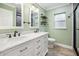 Modern bathroom featuring a double vanity with marble countertop and sleek fixtures at 19300 Sw 60Th St, Dunnellon, FL 34432