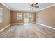 This bright bedroom offers tile floors, a ceiling fan and direct access to an outdoor deck at 19300 Sw 60Th St, Dunnellon, FL 34432