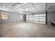 Spacious two car garage with a work bench, windows, and plenty of room for storage at 19300 Sw 60Th St, Dunnellon, FL 34432