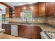 Spacious kitchen with custom cabinets, stainless appliances, and granite countertops at 19300 Sw 60Th St, Dunnellon, FL 34432
