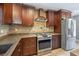 Well-appointed kitchen boasting stainless steel appliances, custom cabinetry, and designer touches at 19300 Sw 60Th St, Dunnellon, FL 34432