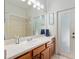 Bathroom with sink, cabinets and large mirror at 19395 Sw 100Th Loop, Dunnellon, FL 34432
