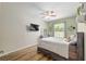Bedroom with laminate flooring, neutral walls, and a comfortable queen-sized bed at 19395 Sw 100Th Loop, Dunnellon, FL 34432