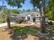 Charming single-story home with a well-manicured lawn and attractive landscaping at 19395 Sw 100Th Loop, Dunnellon, FL 34432