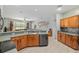 Spacious kitchen featuring generous countertop space and open views to living room at 19395 Sw 100Th Loop, Dunnellon, FL 34432