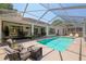 Spacious lanai with pool, lounge chairs and outdoor seating perfect for entertaining at 19395 Sw 100Th Loop, Dunnellon, FL 34432