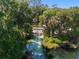Picturesque river with clear water surrounded by lush trees, offering a tranquil and scenic view at 19395 Sw 100Th Loop, Dunnellon, FL 34432