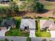 An aerial shot captures the beautifully landscaped community with mature trees at 2008 Palo Alto Ave, The Villages, FL 32159