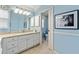 Bright bathroom featuring a granite countertop vanity and separate toilet area at 2008 Palo Alto Ave, The Villages, FL 32159