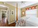 Bedroom showcasing a four poster bed, closet, and patterned bedding at 2008 Palo Alto Ave, The Villages, FL 32159