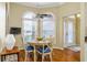 Cozy breakfast nook features a ceiling fan and lots of natural light at 2008 Palo Alto Ave, The Villages, FL 32159