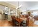 Spacious dining room showcasing wood floors, an open floor plan, and seamless flow into the living spaces at 2008 Palo Alto Ave, The Villages, FL 32159