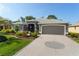 Well-maintained home with a paver driveway and professional landscaping at 2008 Palo Alto Ave, The Villages, FL 32159