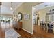 Entryway flowing into the living room with hardwood floors and open floor plan at 2008 Palo Alto Ave, The Villages, FL 32159