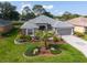 Lovely single Gathering home with a mature palm tree in a beautiful landscaped front yard at 2008 Palo Alto Ave, The Villages, FL 32159