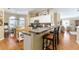 Bright kitchen features granite counters, breakfast bar, white cabinetry and modern appliances at 2008 Palo Alto Ave, The Villages, FL 32159