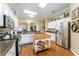 Open kitchen featuring stainless steel appliances, island and convenient access to the dining area at 2008 Palo Alto Ave, The Villages, FL 32159