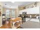 Spacious kitchen with stainless steel appliances, breakfast nook, and bright natural light at 2008 Palo Alto Ave, The Villages, FL 32159