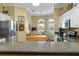 This kitchen features a breakfast bar, stainless appliances, wood floors, and a breakfast nook at 2008 Palo Alto Ave, The Villages, FL 32159