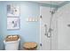 Modern bathroom with a glass-enclosed shower, white tile, and coordinated decor at 2008 Palo Alto Ave, The Villages, FL 32159