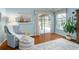 Comfortable sitting area off the main bedroom with a chair, ottoman, and view of the pool at 2008 Palo Alto Ave, The Villages, FL 32159